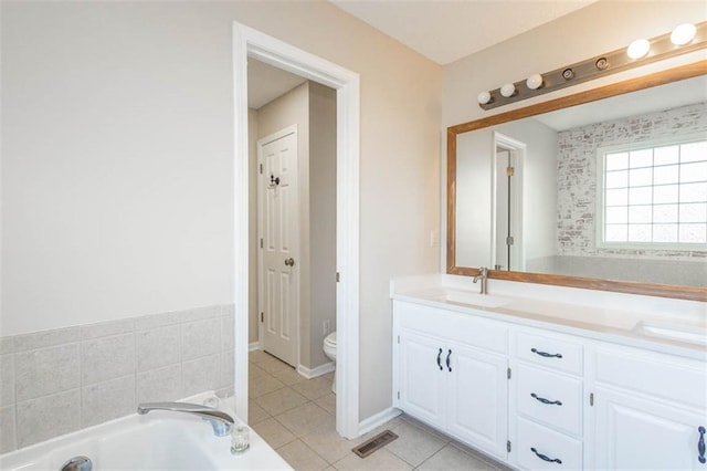 7503 N Lewis Ave, Kansas City, MO 64158 - bathroom with a bath, vanity, and tile patterned floors