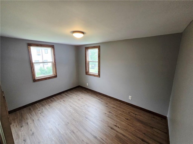 403 S Washington St, Rock Port, MO 64482 - spare room featuring wood finished floors and baseboards
