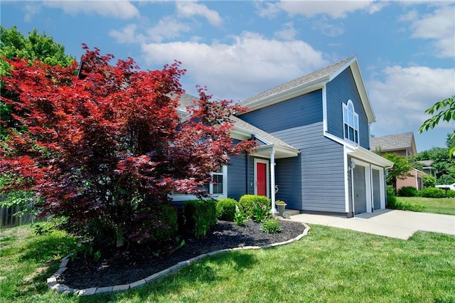 610 SE Joel Ave, Lees Summit, MO 64063 - view of front facade with a garage, concrete driveway, and a front lawn