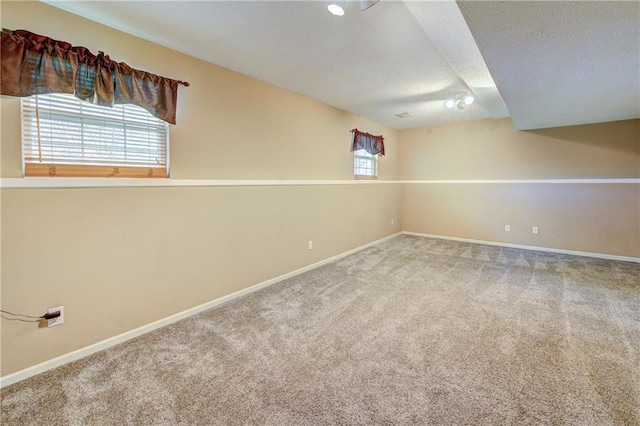 610 SE Joel Ave, Lees Summit, MO 64063 - empty room featuring a textured ceiling and carpet floors