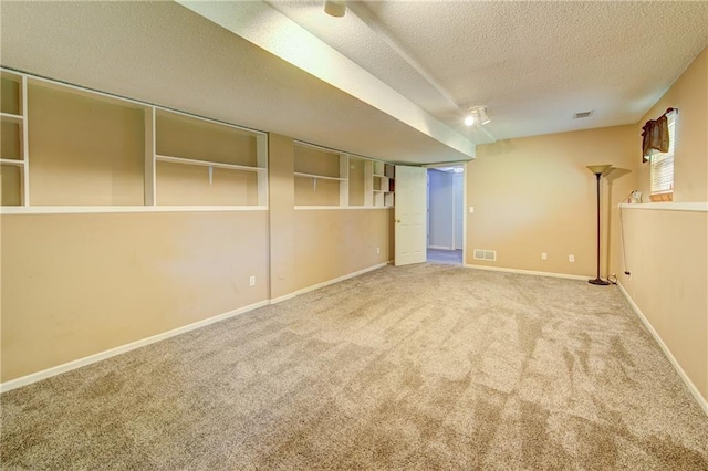 610 SE Joel Ave, Lees Summit, MO 64063 - carpeted spare room featuring a textured ceiling and baseboards