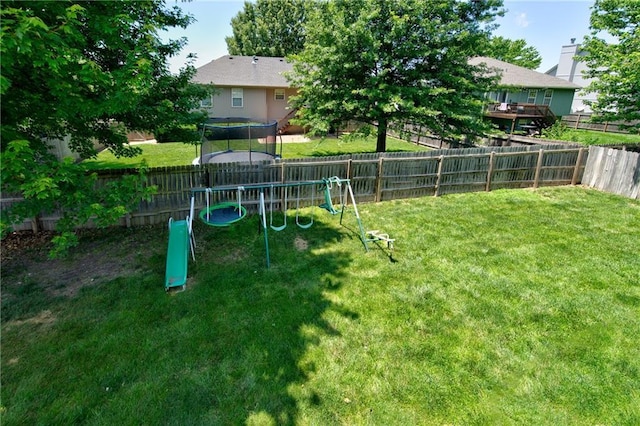 610 SE Joel Ave, Lees Summit, MO 64063 - fenced backyard featuring a trampoline