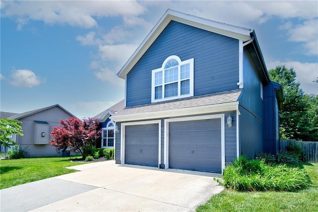 610 SE Joel Ave, Lees Summit, MO 64063 - view of front of home with a garage, concrete driveway, and a shingled roof