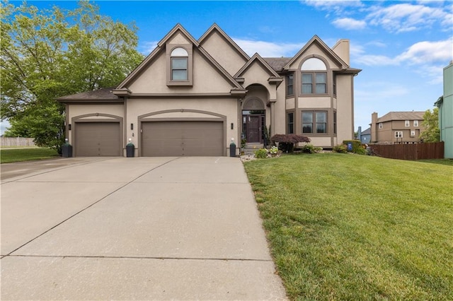 4022 SW Flintrock Dr, Lees Summit, MO 64082 - view of front of home featuring concrete driveway, stucco siding, and a garage