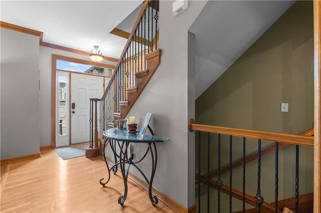 4022 SW Flintrock Dr, Lees Summit, MO 64082 - foyer with baseboards, wood finished floors, and stairs