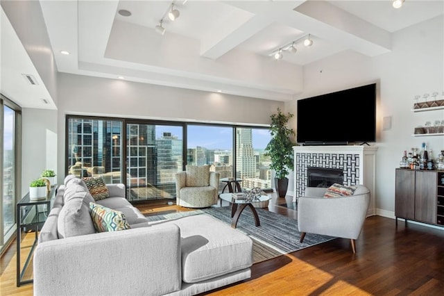 1101 Walnut St Unit 1809, Kansas City, MO 64106 - living area with track lighting, wood finished floors, and plenty of natural light