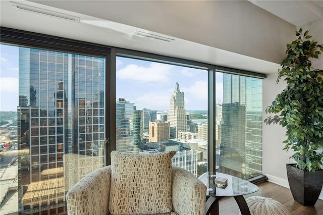 1101 Walnut St Unit 1809, Kansas City, MO 64106 - interior space featuring wood finished floors, baseboards, and a city view