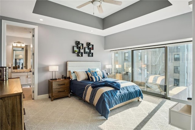 1101 Walnut St Unit 1809, Kansas City, MO 64106 - bedroom with light carpet, recessed lighting, baseboards, ensuite bath, and ceiling fan