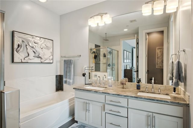 1101 Walnut St Unit 1809, Kansas City, MO 64106 - full bathroom featuring a stall shower, a bath, and double vanity