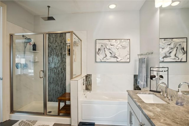 1101 Walnut St Unit 1809, Kansas City, MO 64106 - full bath featuring vanity, a bath, and a shower stall