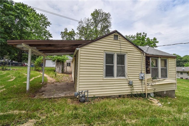 10908 E 66th St, Raytown, MO 64133 - view of side of property with a lawn