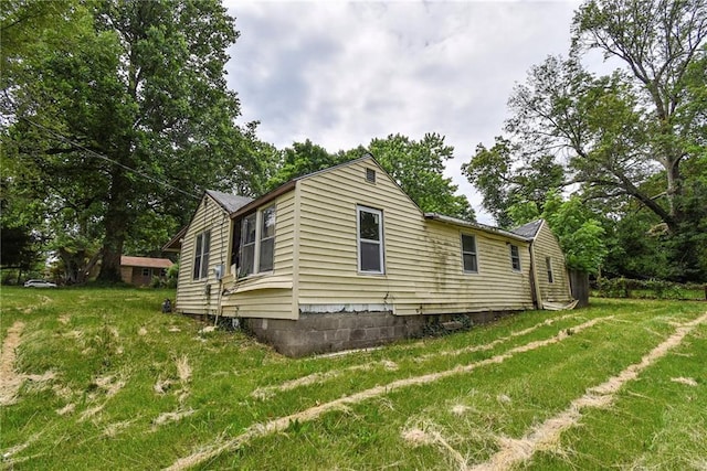 10908 E 66th St, Raytown, MO 64133 - view of side of property with a lawn