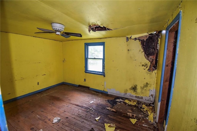 10908 E 66th St, Raytown, MO 64133 - spare room featuring hardwood / wood-style flooring, ceiling fan, and baseboards