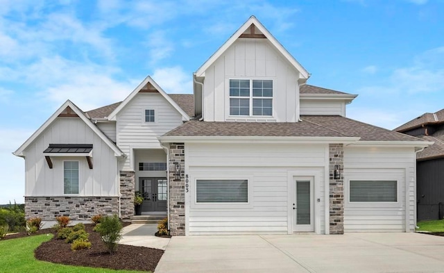 22112 W 80th Ter, Shawnee, KS 66220 - view of front of property featuring board and batten siding, french doors, stone siding, and a shingled roof