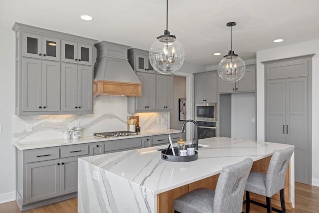 22112 W 80th Ter, Shawnee, KS 66220 - kitchen with gray cabinets, stainless steel appliances, a sink, recessed lighting, and a kitchen island with sink