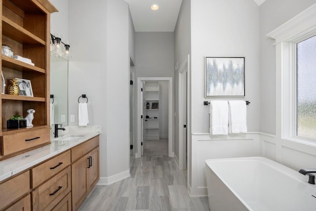 22112 W 80th Ter, Shawnee, KS 66220 - full bath with a freestanding tub, vanity, healthy amount of natural light, and a closet