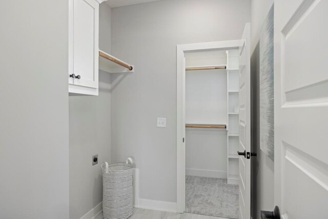 22112 W 80th Ter, Shawnee, KS 66220 - washroom featuring cabinet space, electric dryer hookup, and baseboards