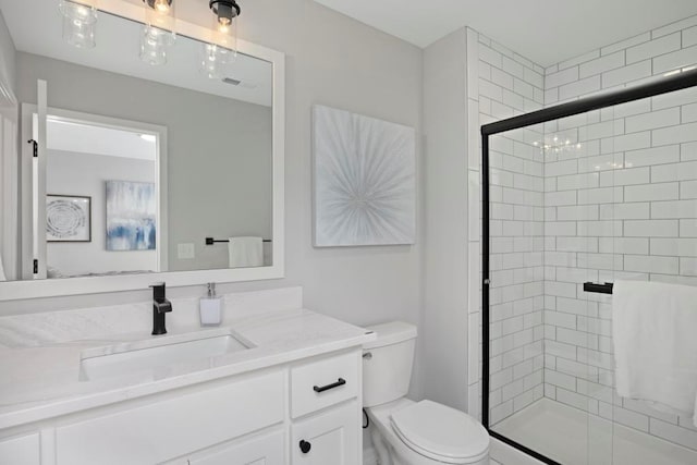 22112 W 80th Ter, Shawnee, KS 66220 - bathroom featuring toilet, vanity, and a stall shower