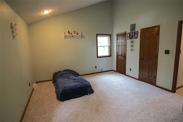 515 Mulberry St, Lees Summit, MO 64086 - sitting room featuring carpet, vaulted ceiling, and baseboards