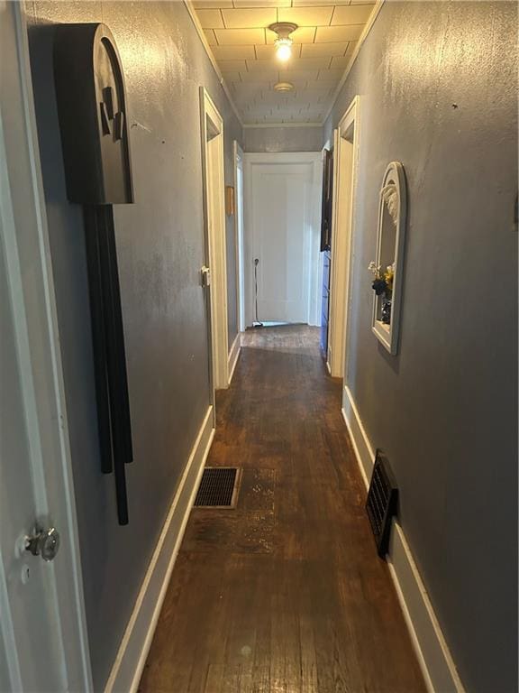 112 W Neosho St, Iola, KS 66749 - hallway featuring wood-type flooring and baseboards
