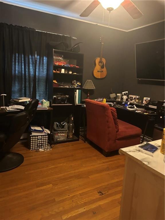 112 W Neosho St, Iola, KS 66749 - home office featuring wood finished floors, ceiling fan, and ornamental molding