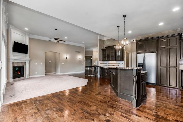 24793 W 98th St, Lenexa, KS 66227 - kitchen featuring stainless steel refrigerator with ice dispenser, a ceiling fan, recessed lighting, dark wood-style floors, and open floor plan