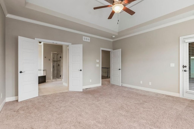 24793 W 98th St, Lenexa, KS 66227 - unfurnished bedroom featuring light colored carpet, a raised ceiling, crown molding, and ensuite bathroom