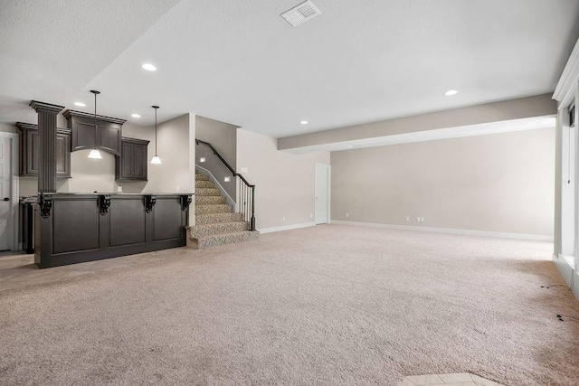 24793 W 98th St, Lenexa, KS 66227 - unfurnished living room with recessed lighting, light colored carpet, and stairs