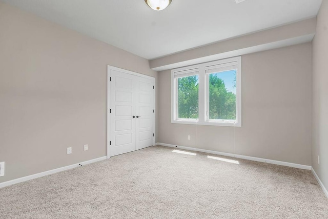 24793 W 98th St, Lenexa, KS 66227 - unfurnished bedroom featuring carpet flooring and a closet