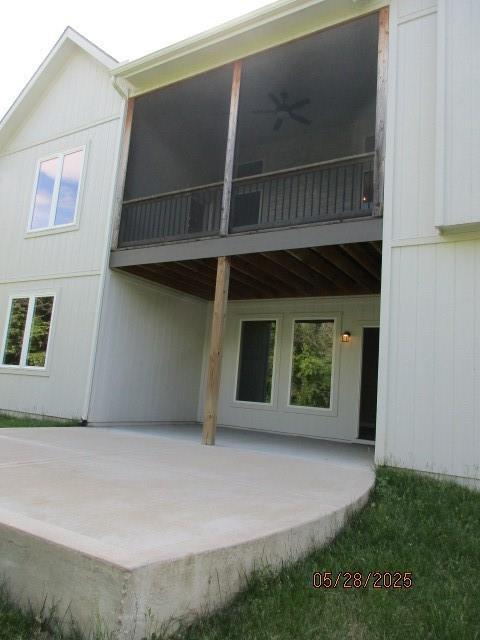 7031 N London Ave, Kansas City, MO 64151 - rear view of property featuring a patio area and a ceiling fan