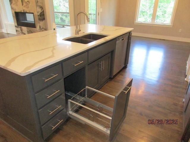 7031 N London Ave, Kansas City, MO 64151 - kitchen with a sink, gray cabinetry, dark wood finished floors, and plenty of natural light