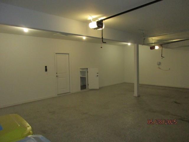 7031 N London Ave, Kansas City, MO 64151 - garage featuring a garage door opener