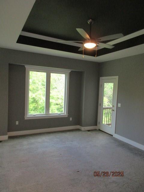 7031 N London Ave, Kansas City, MO 64151 - unfurnished room featuring baseboards, a ceiling fan, and carpet flooring