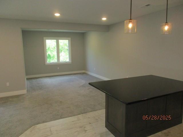7031 N London Ave, Kansas City, MO 64151 - unfurnished room with baseboards, recessed lighting, and light colored carpet