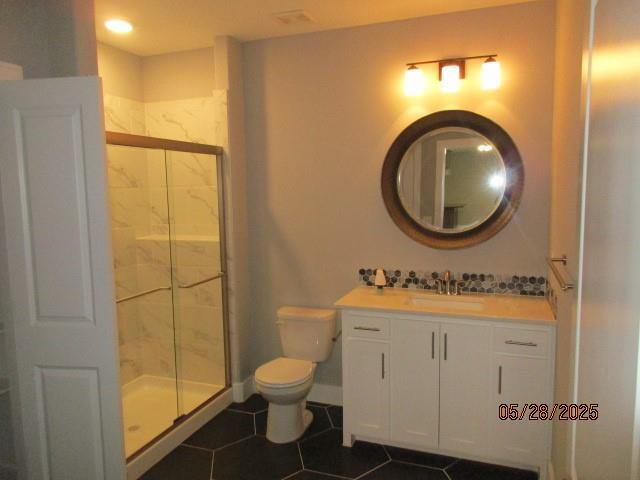 7031 N London Ave, Kansas City, MO 64151 - bathroom featuring toilet, a marble finish shower, vanity, and tile patterned flooring