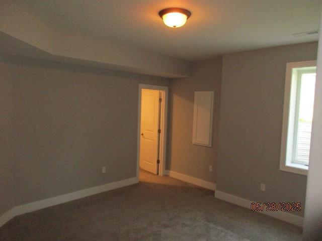 7031 N London Ave, Kansas City, MO 64151 - empty room with carpet floors and baseboards