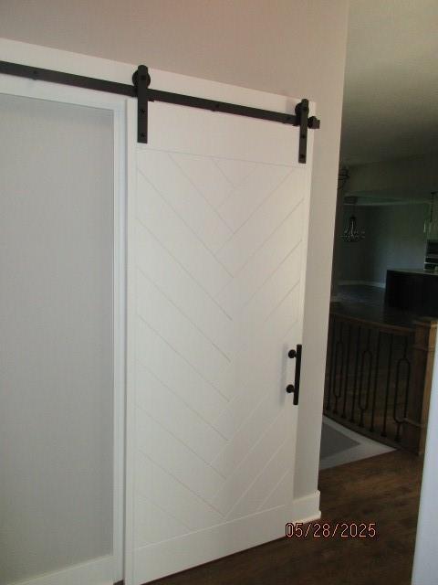 7031 N London Ave, Kansas City, MO 64151 - bathroom with wood finished floors and baseboards
