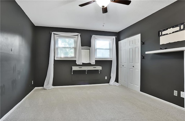 6773 N Askew Cir, Gladstone, MO 64119 - unfurnished bedroom with carpet flooring, ceiling fan, and a closet