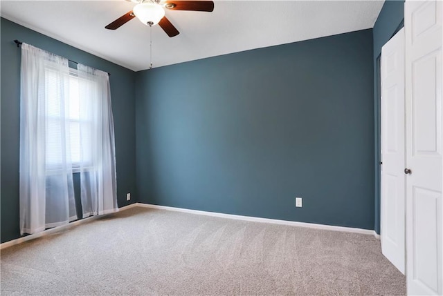 6773 N Askew Cir, Gladstone, MO 64119 - carpeted spare room featuring ceiling fan and baseboards