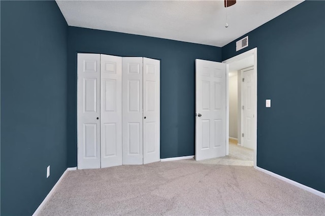 6773 N Askew Cir, Gladstone, MO 64119 - unfurnished bedroom featuring carpet, a closet, and ceiling fan