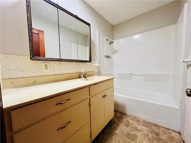 211 W 22nd St, Higginsville, MO 64037 - full bath with vanity, tub / shower combination, and stone finish floors