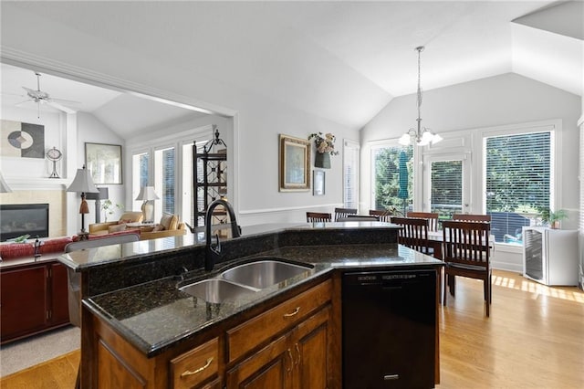 11518 W 143rd Ter, Olathe, KS 66062 - kitchen featuring dishwasher, vaulted ceiling, light wood finished floors, pendant lighting, and a kitchen island with sink