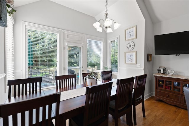 11518 W 143rd Ter, Olathe, KS 66062 - dining room with lofted ceiling, a chandelier, and wood finished floors