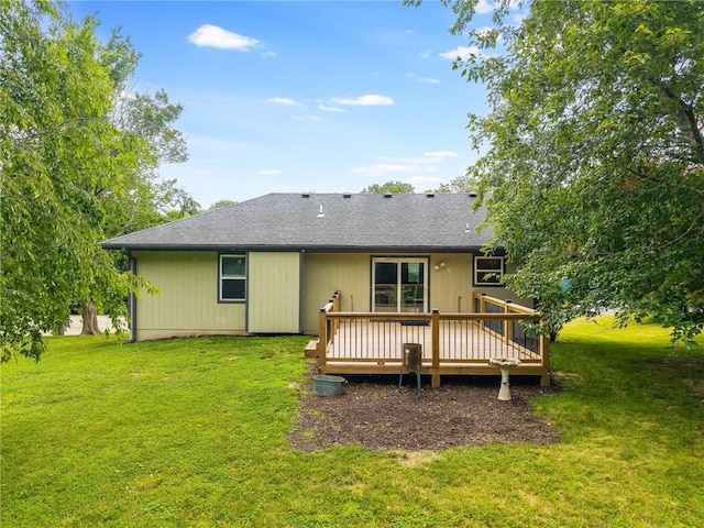 5488 SW Reed Ln, Trimble, MO 64492 - rear view of house with a deck, a yard, and a shingled roof