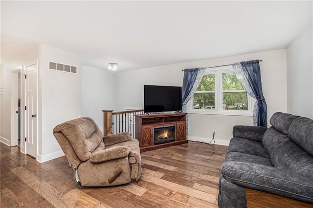 504 W 5th Ct, Peculiar, MO 64078 - living area with wood finished floors and baseboards