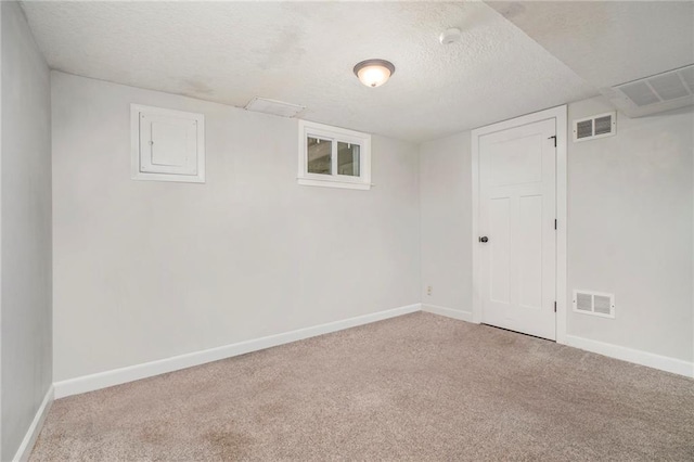 504 W 5th Ct, Peculiar, MO 64078 - finished below grade area featuring carpet flooring, a textured ceiling, and baseboards