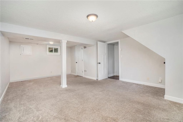 504 W 5th Ct, Peculiar, MO 64078 - finished basement featuring carpet floors, a textured ceiling, and baseboards