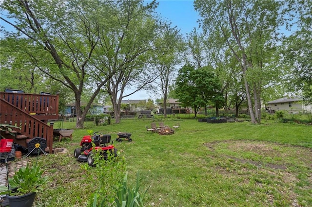 504 W 5th Ct, Peculiar, MO 64078 - view of yard with a fire pit and a deck