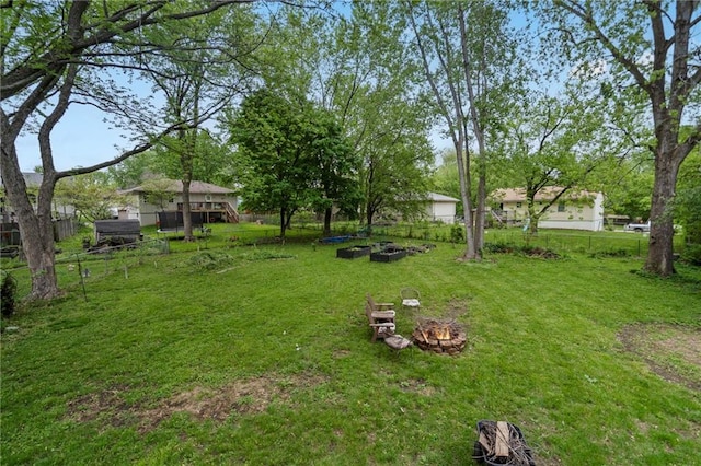 504 W 5th Ct, Peculiar, MO 64078 - view of grassy yard featuring an outdoor fire pit