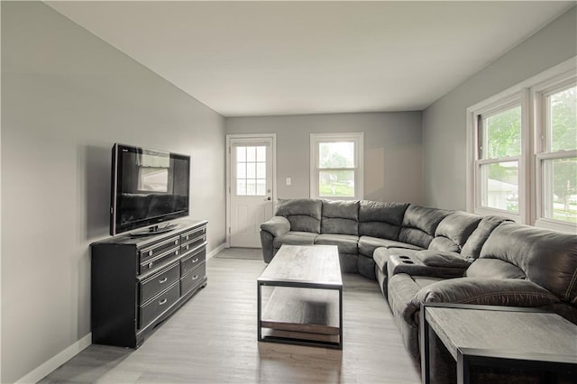 4511 NE 45th St, Kansas City, MO 64117 - living area featuring healthy amount of natural light and light wood-style floors